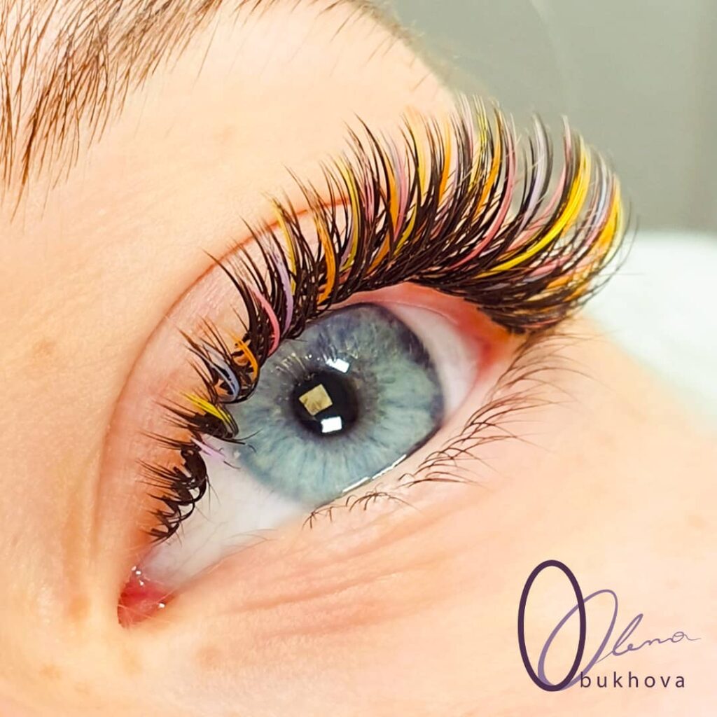 Wet look with multi-colored spikes: brown, yellow, orange, pink, and lilac lashes.